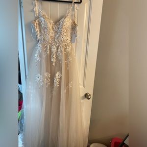 “Say Yes to Prom” prom dress! it’s a cream and white dress with flowers on it !